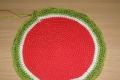 Knitted napkin in the form of a watermelon